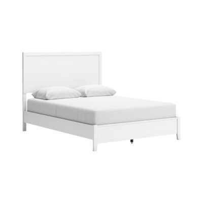 a white bed with pillows