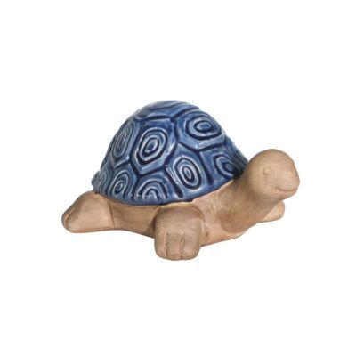 a ceramic turtle with a blue shell