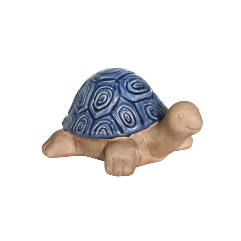 a ceramic turtle with a blue shell