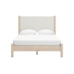 cama queen tapizada crema y blanca
