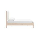 cama queen tapizada crema y blanca