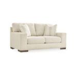a white couch with pillows
