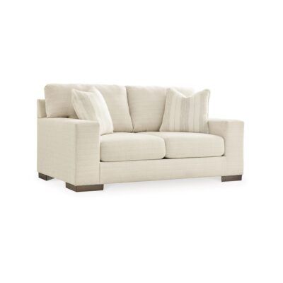 a white couch with pillows