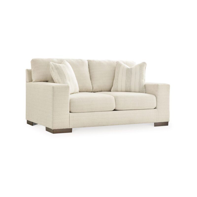 a white couch with pillows