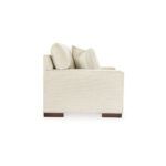 a white couch with pillows